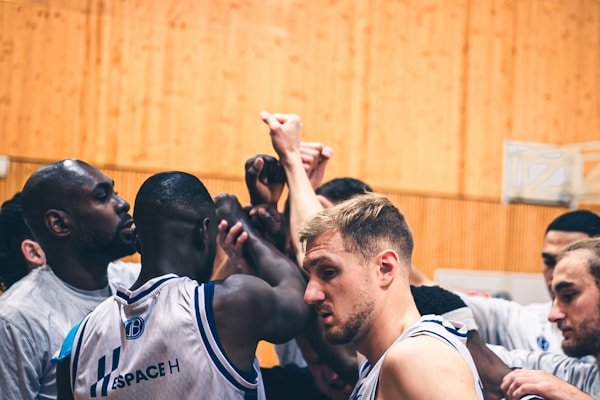 Sports teams huddling before a game